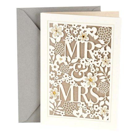 a card with the word mr and mrs cut out in white paper on top of an envelope