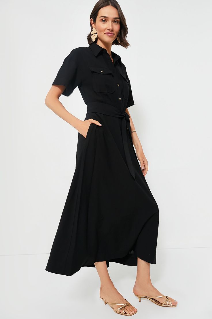 The Black Lucienne Dress takes elements you love from your favorite trench coat, button down, and maxi dress to create the style of all styles. This elegant number boasts a spread collar, short sleeves, front chest pockets, and a self-tie waistband to create an elevated and ultra-flattering silhouette. We are pairing this with everything from boots and a neck scarf to heels and gold accessories. Spread collar Short sleeves with cuffs Front button placket Double-breasted front flap pockets Adjust Maxi Dress Sale, Plus And Minus, Cocktail Attire, Neck Scarf, Gold Accessories, Weekend Wear, Office Fashion, Black Maxi Dress, Button Placket