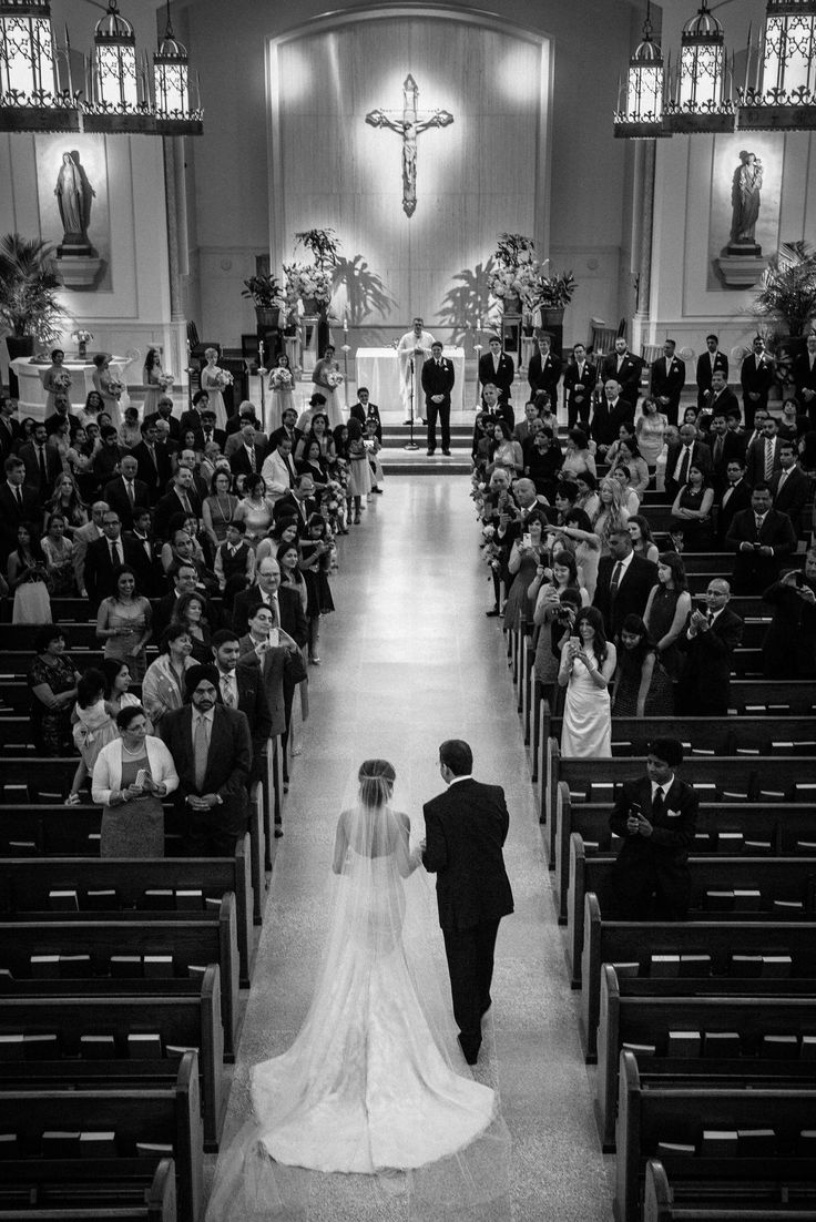 the bride and groom are walking down the aisle