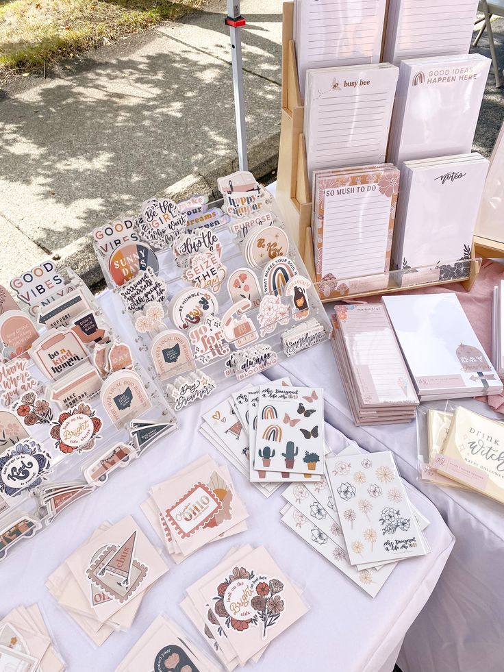 a table with lots of cards and papers on it