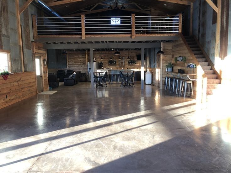 the inside of a barn with wooden walls and ceilings