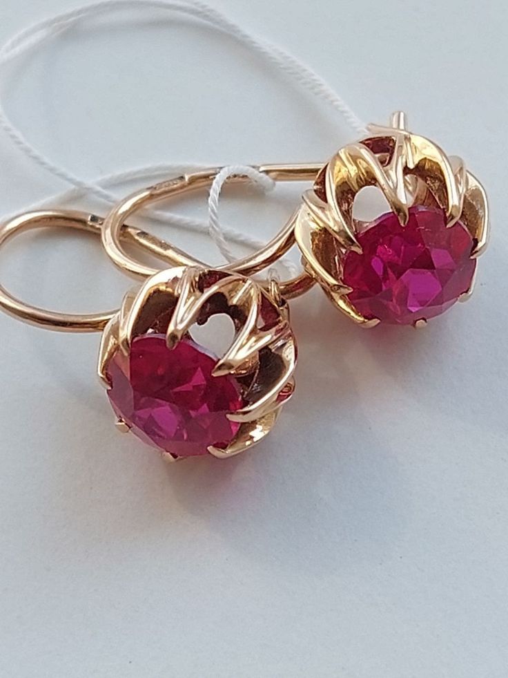 Vintage 14K Beautiful Water Lily Earrings Ruby Corundum USSR 583 Rose Gold Soviet Retro Russian Women's jewelry, Vintage gift for woman and girlBase Metal: Gold 14K (Russian Hallmark: 583 Star with Sickle and Hammer)Base Stone: Ruby LAB (synthetic)Manufacturer Country: USSR Soviet Union RussiaTotal weight: 4.33 g.Enjoy your shopping! Russian Jewelry Modern, Formal Pink Gold Gemstone Earrings, 14k Rose Gold Round Earrings As Gift, Classic Pink Hallmarked Earrings, Pink Gold Earrings With Prong Setting For Anniversary, Anniversary Pink Gold Earrings With Prong Setting, Ruby Earrings With Prong Setting, Elegant Ruby Jewelry In Pink Gold, 14k Rose Gold Wedding Earrings