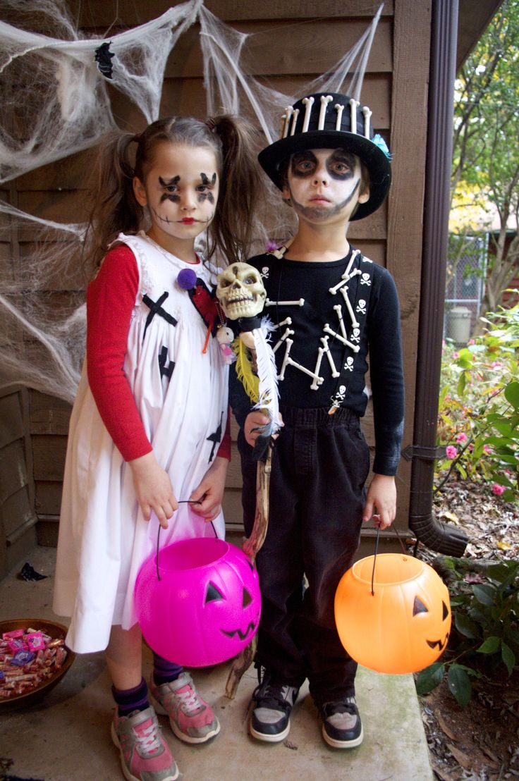 two children dressed up in halloween costumes