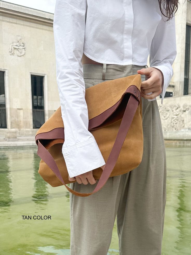 "Suede Leather Bag by ELEVEN600 Shop. Beautiful Suede leather Hobo bag, natural.  DETAILS: -This bag comes with an internal pocket, leather keychain and magnetic closure. -Simple and stylish.  DIMENSIONS SIZE M: Height: 13,8\" inches / 35 cm Width: 15,8\" inches / 40 cm Depth: 3,5\" inches / 8 cm Strap: 23,62\" inches / 60cm  DIMENSIONS SIZE L: Height: 19,6\" inches / 50 cm Width: 15,54\" inches / 42 cm Depth: 2,76\" inches / 7 cm Strap: 23,62\" inches / 60cm  Please message me if you have any doubt. Thank you very much for visiting our Etsy shop! ;) Best Regards, Isabel -" Everyday Bucket Bag With Magnetic Closure, Beige Shoulder Bag With Magnetic Closure For Everyday, Leather Shoulder Bag With Magnetic Closure For Daily Use, Beige Satchel With Magnetic Closure For Everyday Use, Leather Square Hobo Bag For Everyday, Square Leather Hobo Bag For Everyday Use, Rectangular Bucket Bag With Leather Strap For Daily Use, Leather Strap Tote Bucket Bag For Daily Use, Brown Leather Strap Bucket Bag For Everyday Use