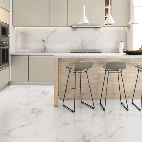 three stools in front of a marble counter top