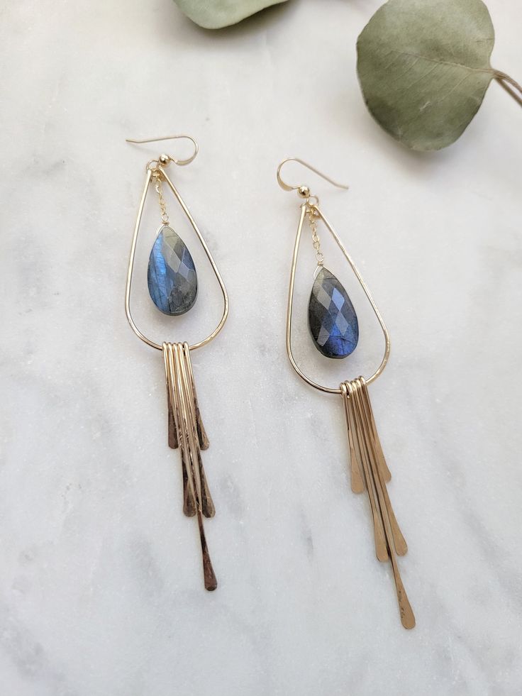 The Labradorite Fringe Earrings are a beautiful statement pair of earrings! One of my favorites! Definitely a special gift for a friend or yourself! . ** Blue and Purple Blue stones left. Please refer to 3rd picture Each earring is hand formed and hammered for texture and shape. The length of the earrings are about 3 1/2 inches. Each piece is handmade and may vary slightly as well as the stones as they are natural. ** The stones will vary in color and in size. Some are more blue, green, or yello Fringe Earrings, Blue Stone, Gemstone Earrings, Labradorite, Blue And Purple, Special Gifts, Beaded Jewelry, Etsy Earrings, Dangle Drop Earrings