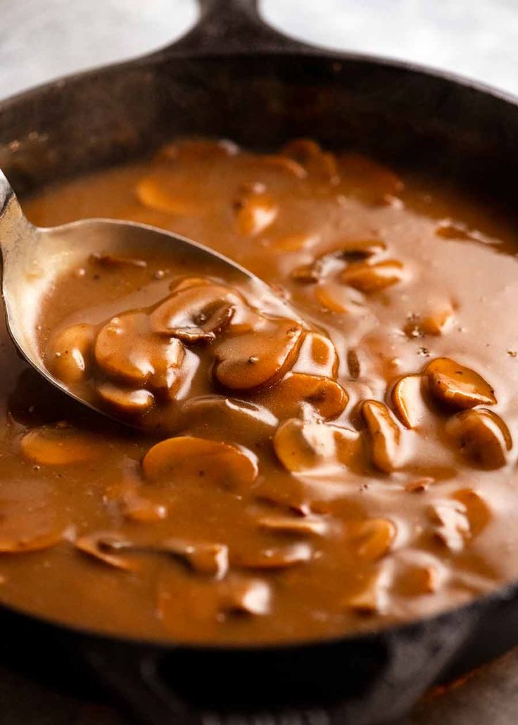 a skillet filled with beans and sauce