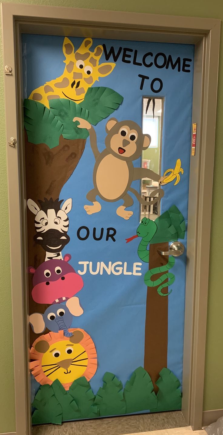 a door decorated with an animal theme and the words welcome to our jungle on it