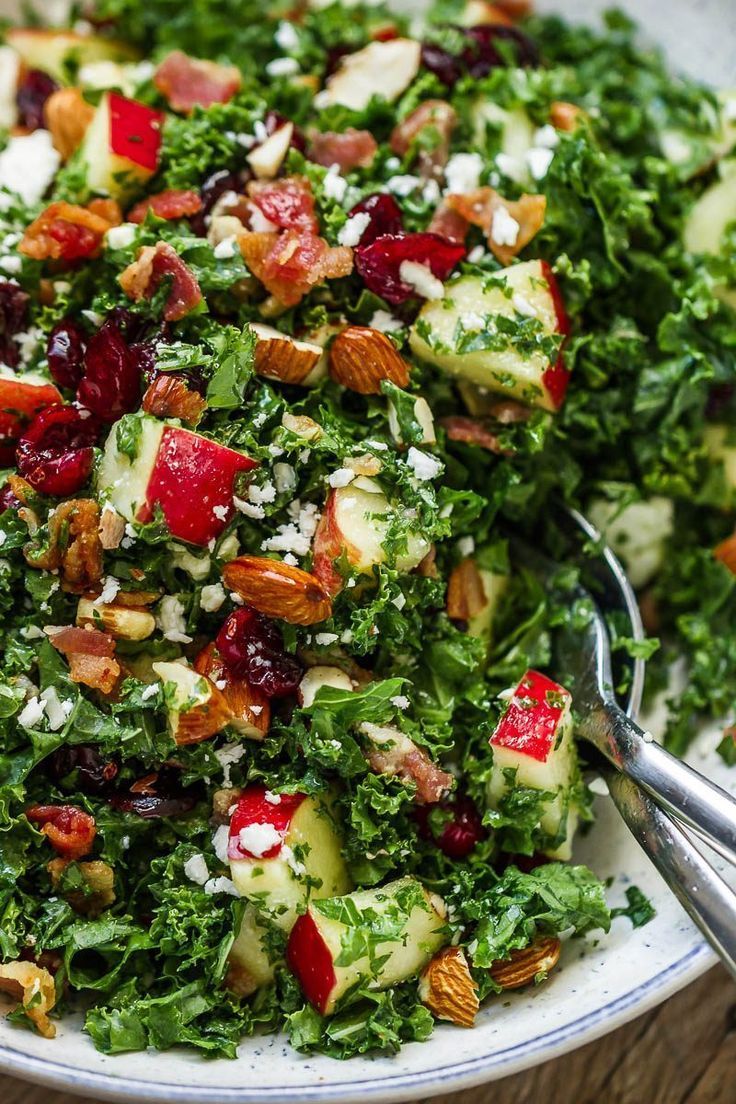 a salad with apples, cranberries and pecans