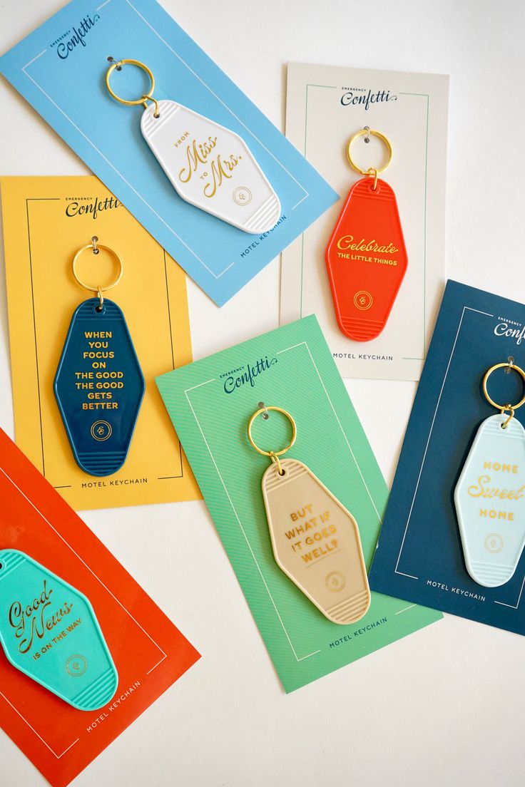 Celebrate the Little Things Keychain – Emergency Confetti Motel Keychain Packaging, Keychain Packaging Design, Packaging For Keychain, Unique Merch Ideas, Vintage Motel Keychain, Hotel Key Card Design, Hotel Keychain Ideas, Hotel Keychain Design, Key Ring Ideas