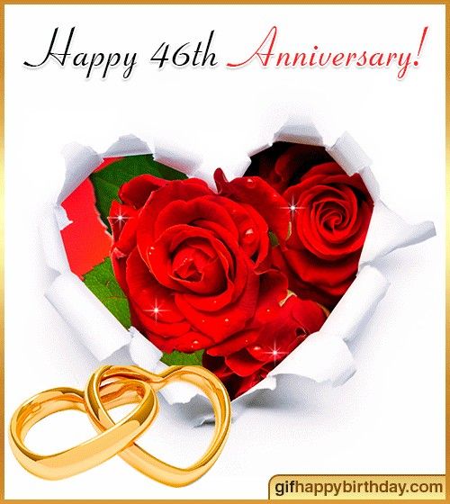 two gold wedding rings are in front of a heart - shaped hole with red roses