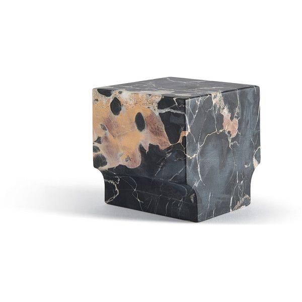 a black and gold marble block on a white background