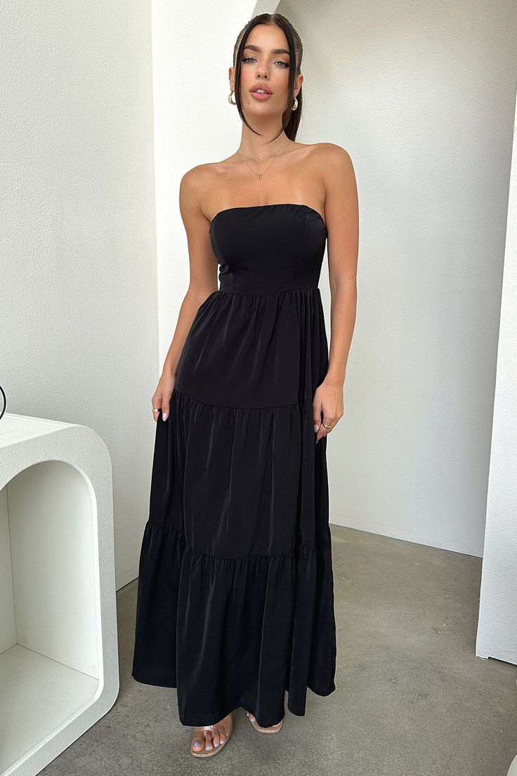 The perfect summer maxi! This gorg babe features a strapless cut, flowy fit, double lining and a shirred back for stretch. Style her with white sandals, little hoops and natural glowy makeup. FABRICATION: 65% Cotton / 35% polyester SIZING: Crystal's height is 162cm and wears a size AU6/US2 Chic Bandeau Strapless Dress For Beach Season, Chic Bandeau Strapless Dress For Beach, Chic Ruched Strapless Dress For Vacation, Black Strapless Maxi Dress For Beach, Summer Strapless Dress With Smocked Back For Beach, Black Strapless Mini Dress For Summer, Solid Strapless Maxi Dress For Date Night, Black Bandeau Maxi Dress For Summer, Strapless Solid Maxi Dress For Date Night