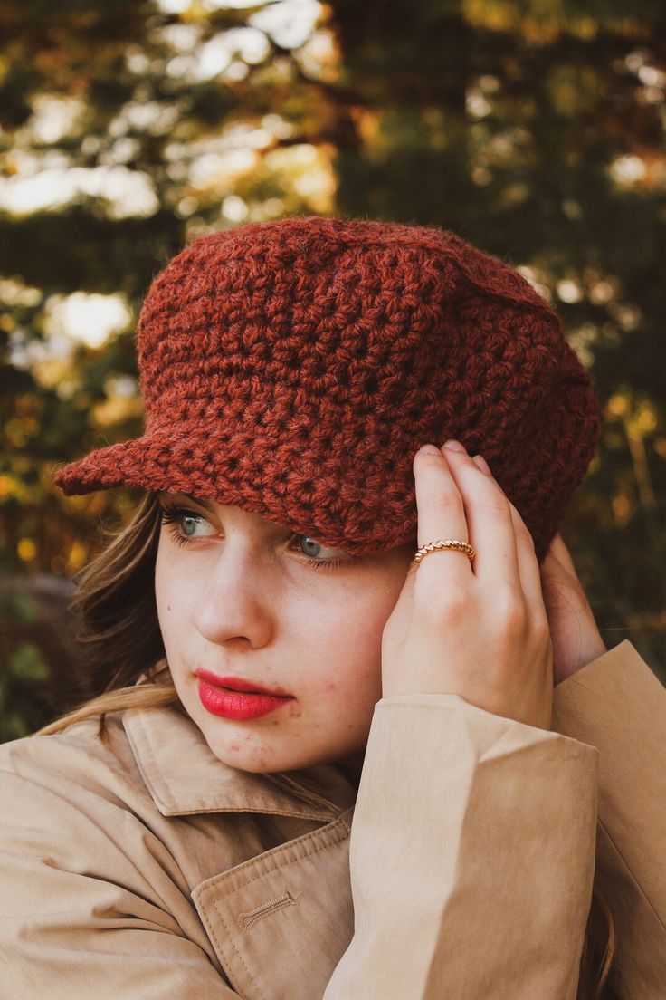 a woman wearing a red crocheted hat with her hands on her head and the caption reads, recreating the red taylor's version photos