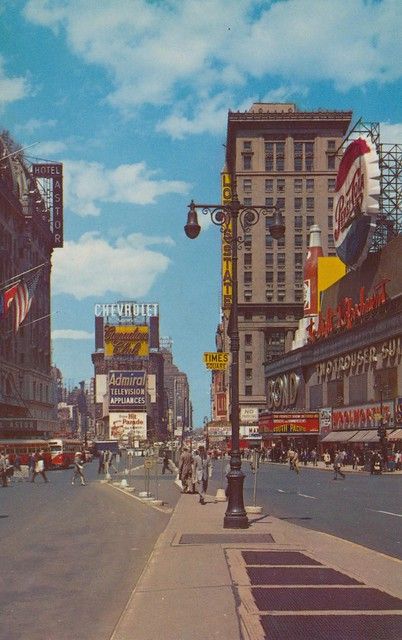 an old photo of a city street in the 1950's or early 1960s's