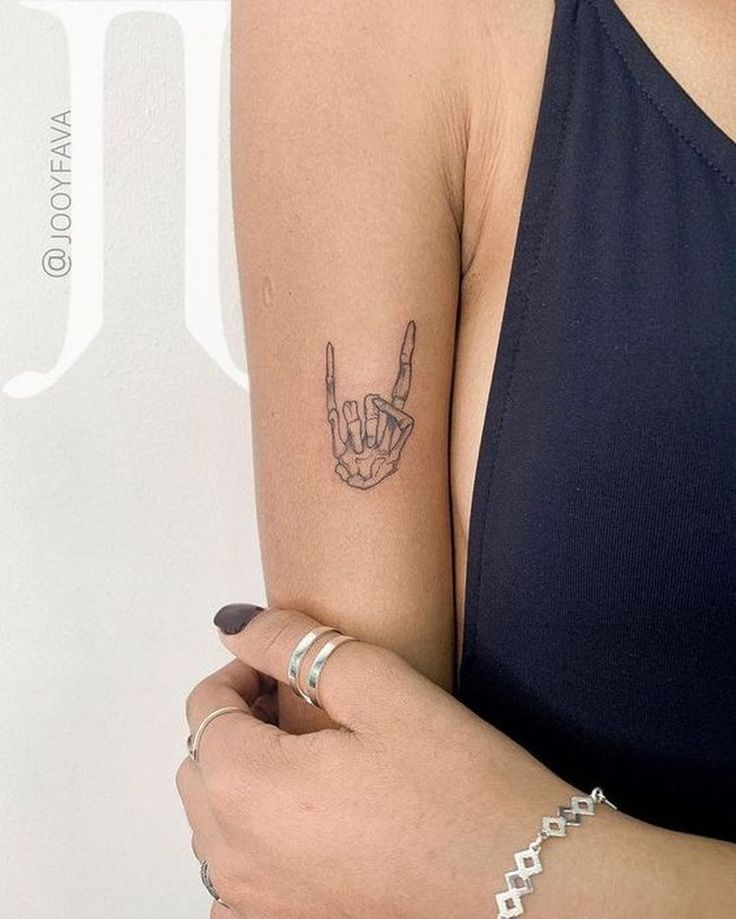 a woman with a tattoo on her arm