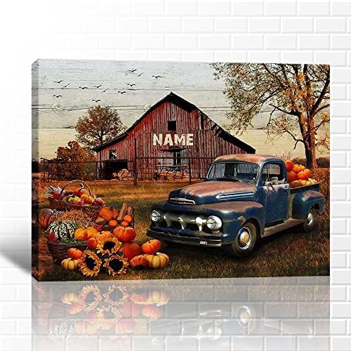 an old truck with pumpkins in the foreground and a barn in the background