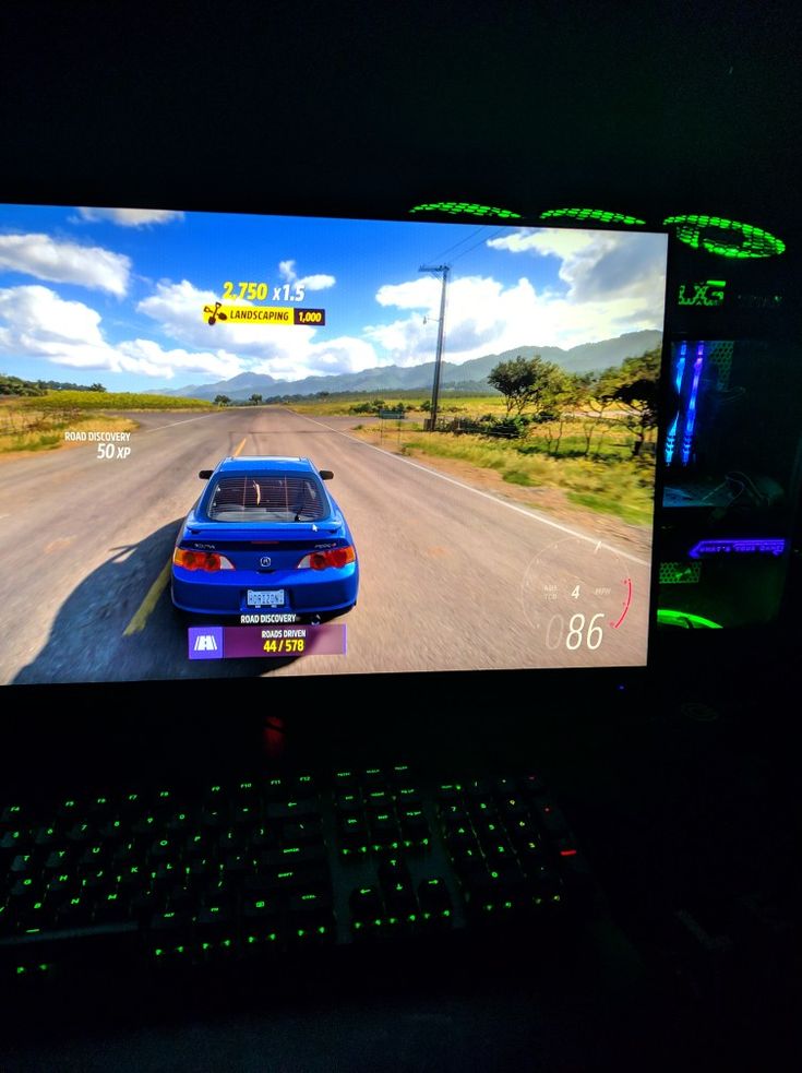 a computer screen showing a car driving on the road