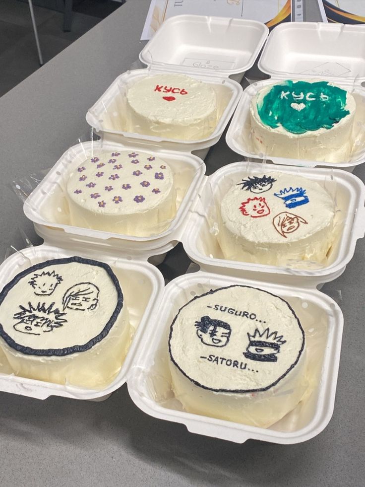 six plastic containers filled with different types of cakes on top of a gray countertop