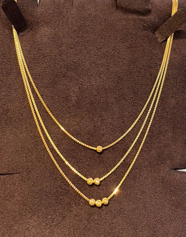 3 layers 22k solid gold necklace , 916 Yellow Gold GOLD PURITY : pure 22k / 916 gold purity Appx Weight: 10 - 12 grams Length  :  16-18" length  Colour : YELLOW GOLD Hallmark: Hallmarked 916 stamp Hook: '' lobster hook Design  :3 layers Beautiful layered choker necklace pendant necklace set.  Item is sold as per piece basis. Weight indicated is for reference. Authentic 916 Gold FAQs Q: Is it real gold? A: yes it's real authentic genuine 916 gold  Q: can pawn? A: yes it's pawnable ⭐️GoForGenuineG 10 Grams Gold Choker Designs, 12 Grams Gold Necklace, 16 Grams Gold Necklace Designs, Gold Jewelry Simple Necklace Indian, 10 Grams Gold Necklace, Gold Set Bridal, 8 Grams Gold Necklace, Gold Set Designs, Dubai Gold Necklace