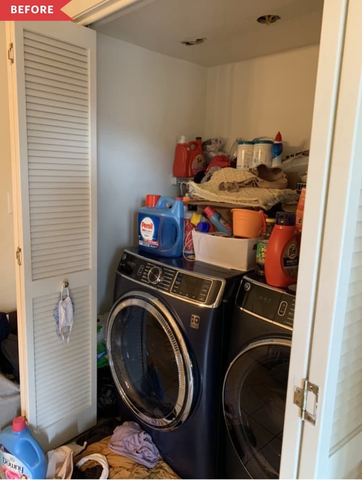 a washer and dryer in a small room next to a closet with doors open