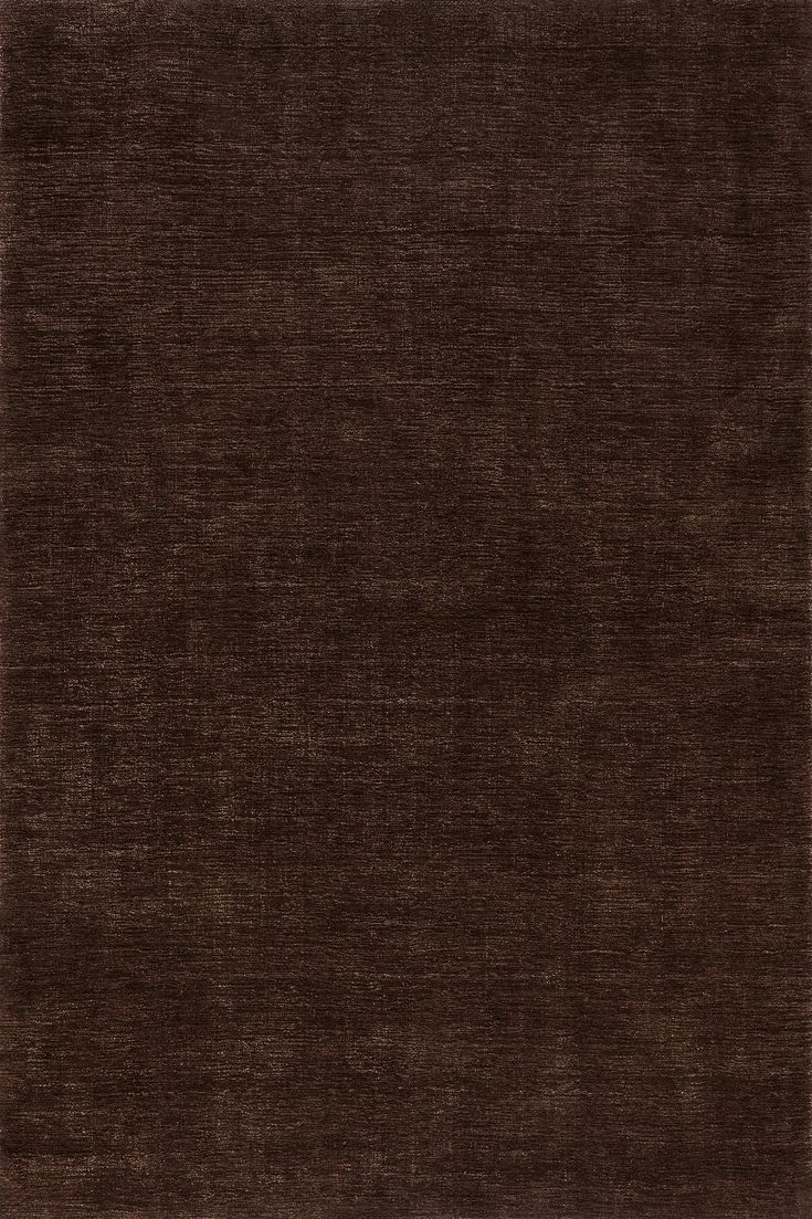 an area rug with dark brown colors