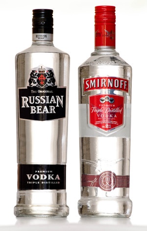 two bottles of vodka sitting next to each other