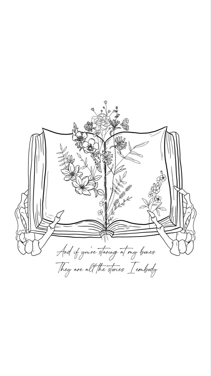 an open book with flowers on it