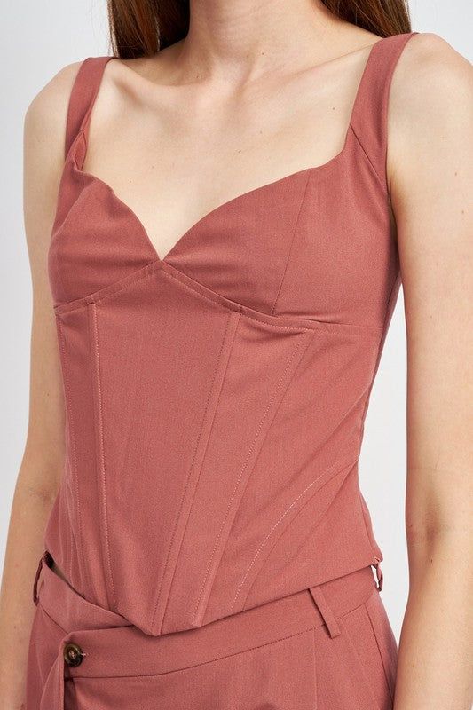 The Emory Park V Neck Bustier Top is a stylish and comfortable blouse made of a soft and stretchy 76% polyester, 17% rayon, and 7% spandex blend. A thick, non-sheer fabric allows for long-lasting wear without sacrificing breathability. An ideal choice for a polished look. You'll feel good and look even better, even after a full day of wear. The V Neck Bustier Top offers you the perfect combination of style and comfort. V Neck Bustier Top Details : SIZE & FIT :MODEL WEARS SIZE SMALLMODEL'S HEIGHT Comfortable Blouses, Contemporary Clothing, Design Clothes, Contemporary Outfits, Bustier Top, Sheer Fabric, Sheer Fabrics, Polished Look, V Neck Dress