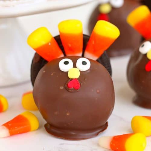 chocolate candy candies decorated like turkeys with candy corn on the bottom and nose