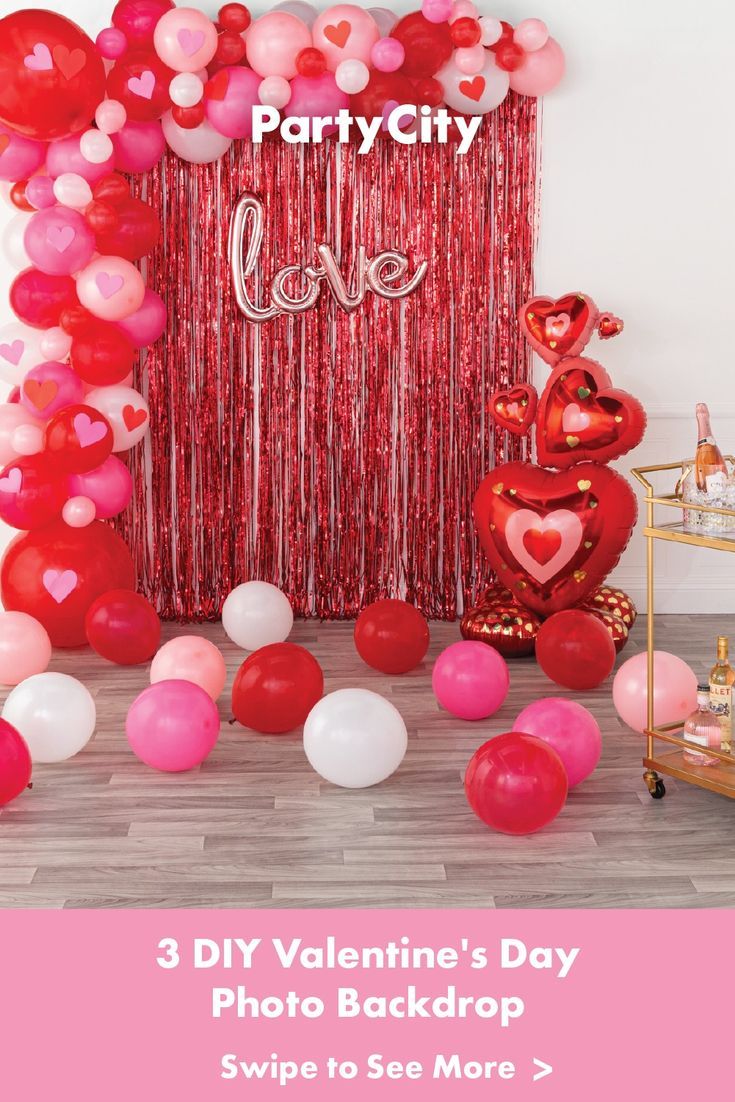 valentine's day photo backdrop with balloons and streamers