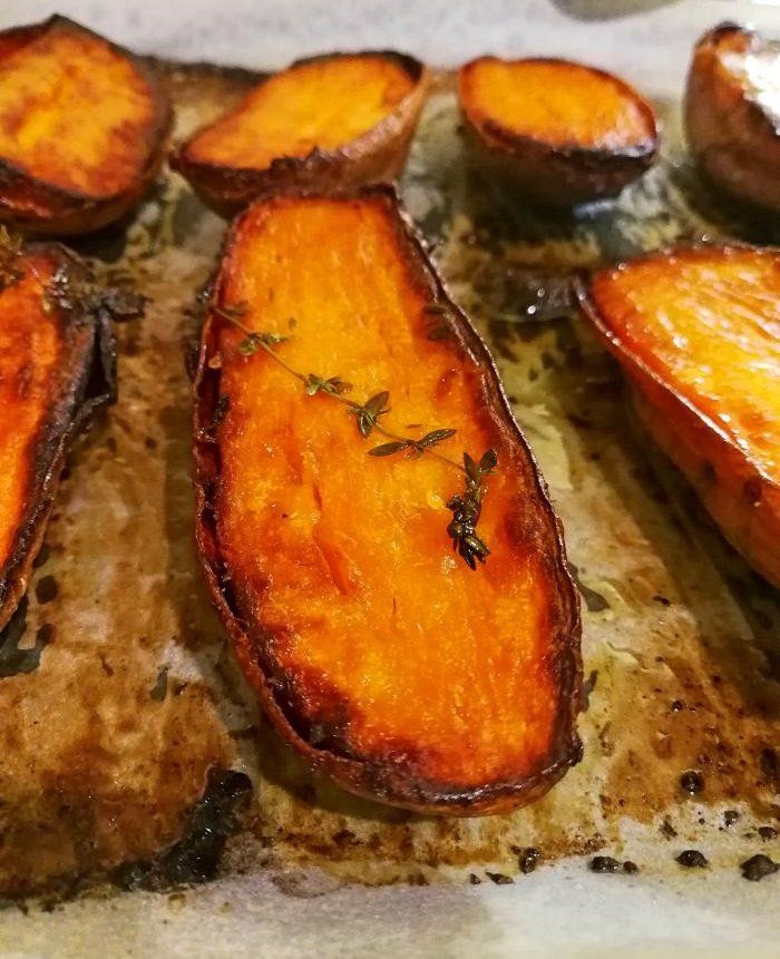 some sliced up sweet potatoes sitting on top of a cutting board