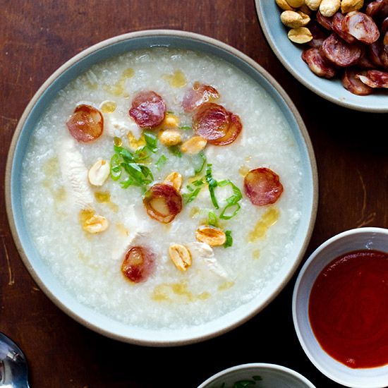 three bowls of food on a wooden table