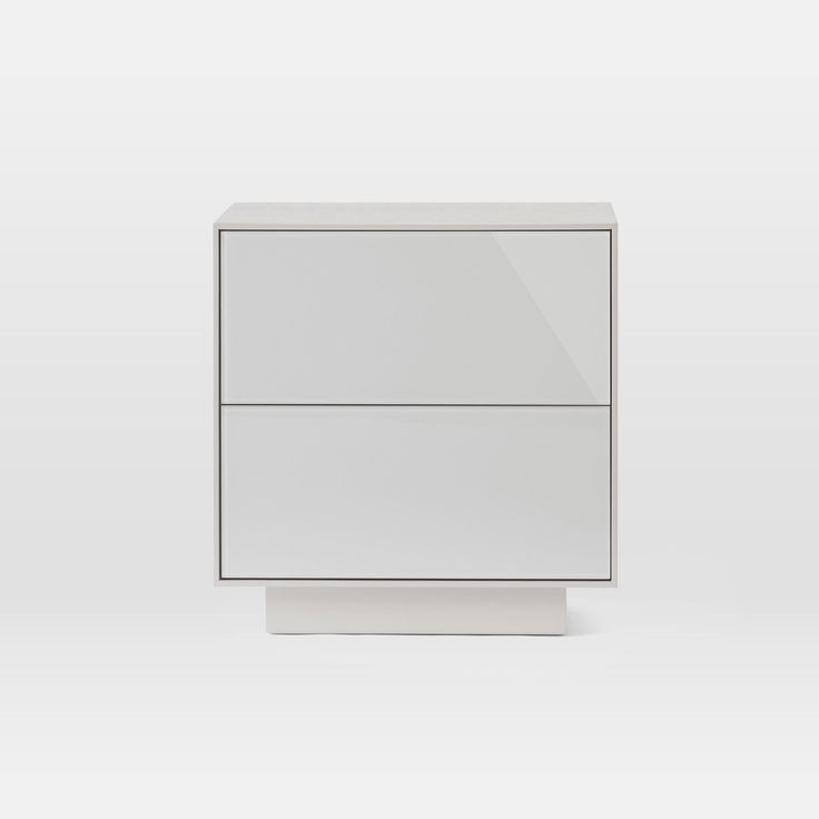 a white cabinet with two drawers on each side