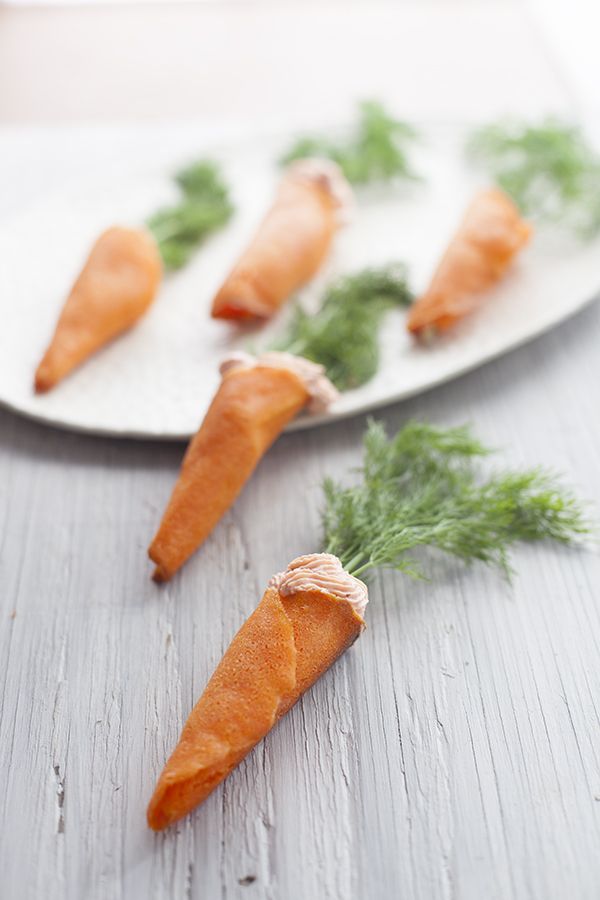 small carrots on a plate with parsley