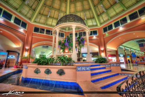 an indoor fountain in the middle of a lobby