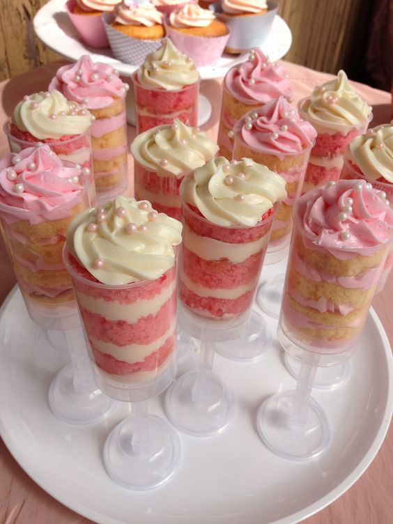 several cupcakes are arranged on a white plate