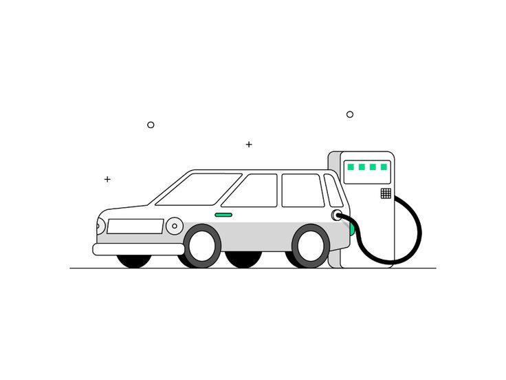 an electric car charging at a gas station