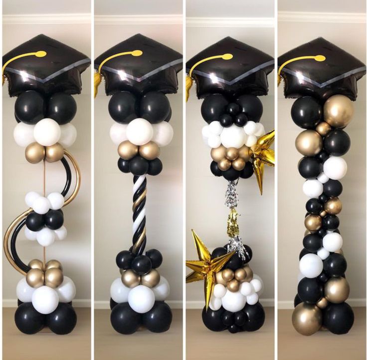 graduation decorations are arranged in black, white and gold colors with balloons attached to them