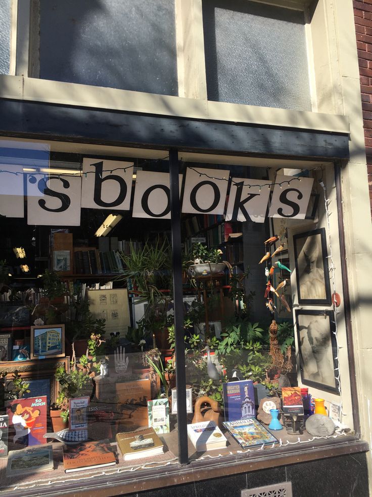 the front window of a book store with books on display in it's windows