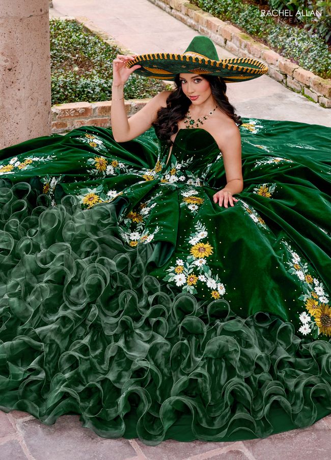 a woman in a green dress and sombrero