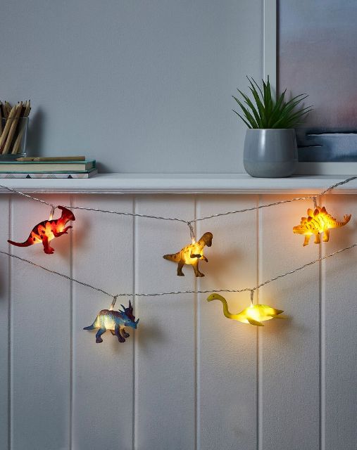 the string lights are decorated with dinosaurs