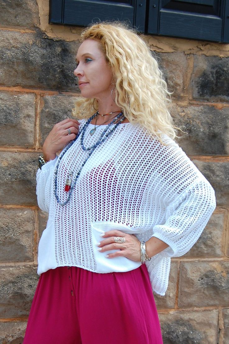 The Atticus Knit Top in White ♡ Product Highlights ♡ • Our Atticus Knit Top in White is the perfect go-to top to add to your closet, and or any on-trend bohemian style outfit! Giving your look a cozy element, this top comes with a stylish crochet detail design, and comes with 2 conveniently placed front pockets. Pair and layer with a trendy kimono, or stylish jacket, our Be Kind Graphic Tee will be sure to become a favorite of your closet! ✁ Contents & Measurements ✁ • This Atticus Knit Top in W Bohemian Open Knit Sweater For Day Out, Bohemian Long Sleeve Sweater For Day Out, Spring Beach Sweater In Chunky Knit, Spring Chunky Knit Beach Sweater, Spring Chunky Knit Sweater For Beach, Chunky Knit Sweater For Spring Beach Outings, Bohemian Knit Sweater For Day Out, Bohemian Long Sleeve Textured Knit Tops, Bohemian Textured Knit Sweater For Spring