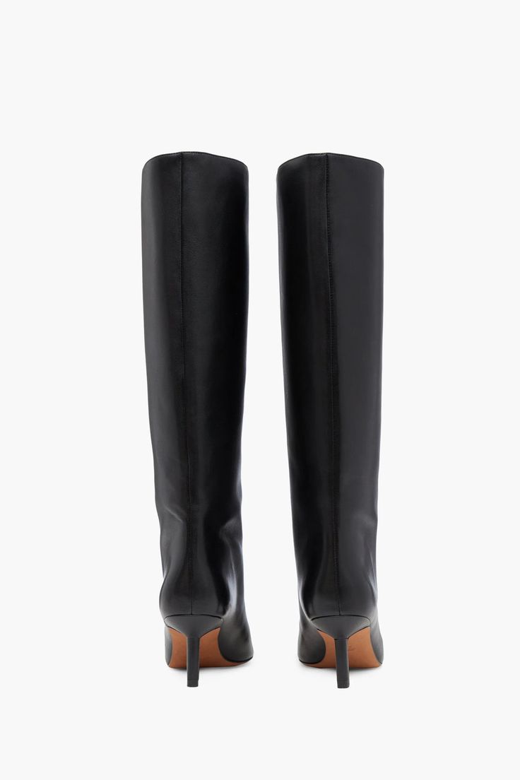 Echoing East Side elegance, the Nell boot sweeps up the calf to a dramatic knee height. They're crafted in smooth leather that flows towards a sharp square toe. Black Smooth leather 65mm stiletto heel Logo footbed Square toe Zip side fastening 100% sheepskin SKU: SF23T893MDLBLACK Luxury Knee-high Boots With Sculpted Heel And Square Toe, Elegant Tall Boots For Workwear, Elegant Tall Boots For Work, Chic Tall Mid-calf Boots For Formal Occasions, Luxury Knee-high Boots With Square Toe And Reinforced Heel, Luxury Knee-high Boots With Reinforced Heel And Square Toe, Classic Formal Calf Leather Platform Boots, Elegant Knee-high Platform Boots With Leather Lining, Elegant Wide Calf Tall Mid-calf Boots