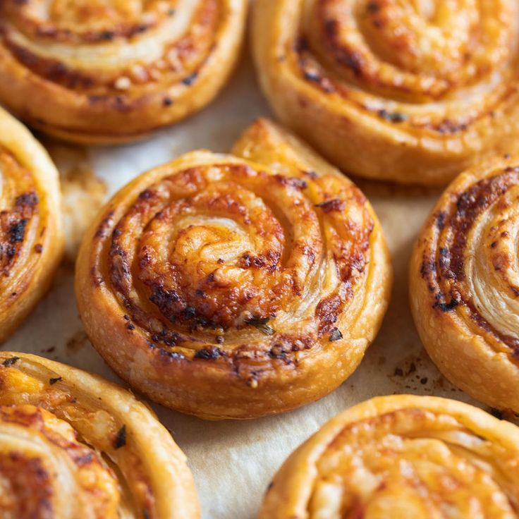 several cinnamon rolls on a baking sheet ready to be baked in the oven or used as an appetizer