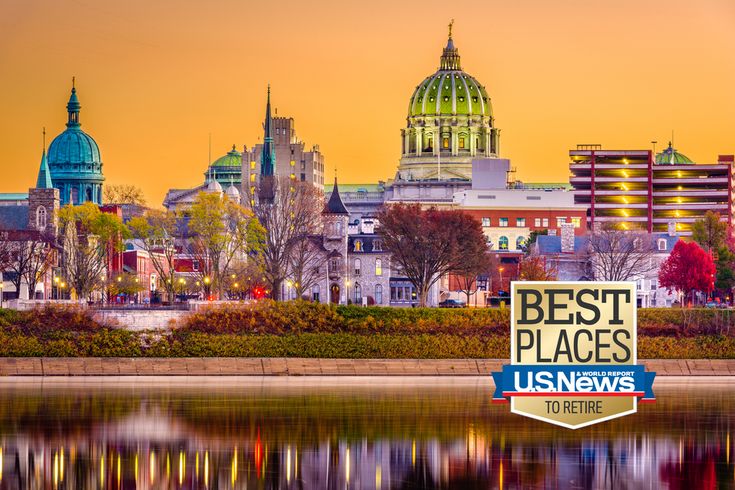 the best places sign is in front of a cityscape with buildings and trees