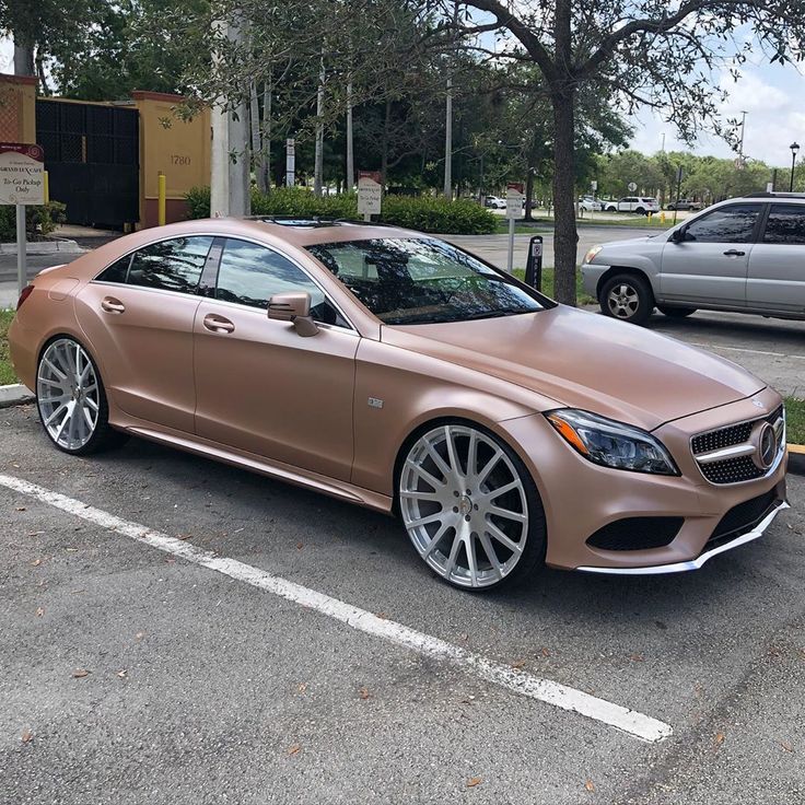 a brown car parked in a parking lot