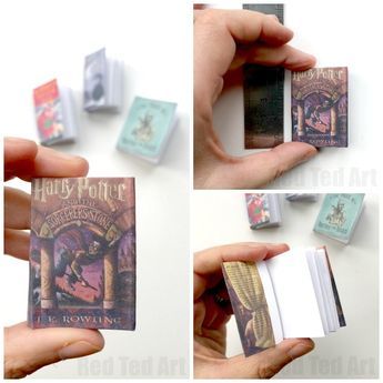 the harry potter playing cards are being held by someone