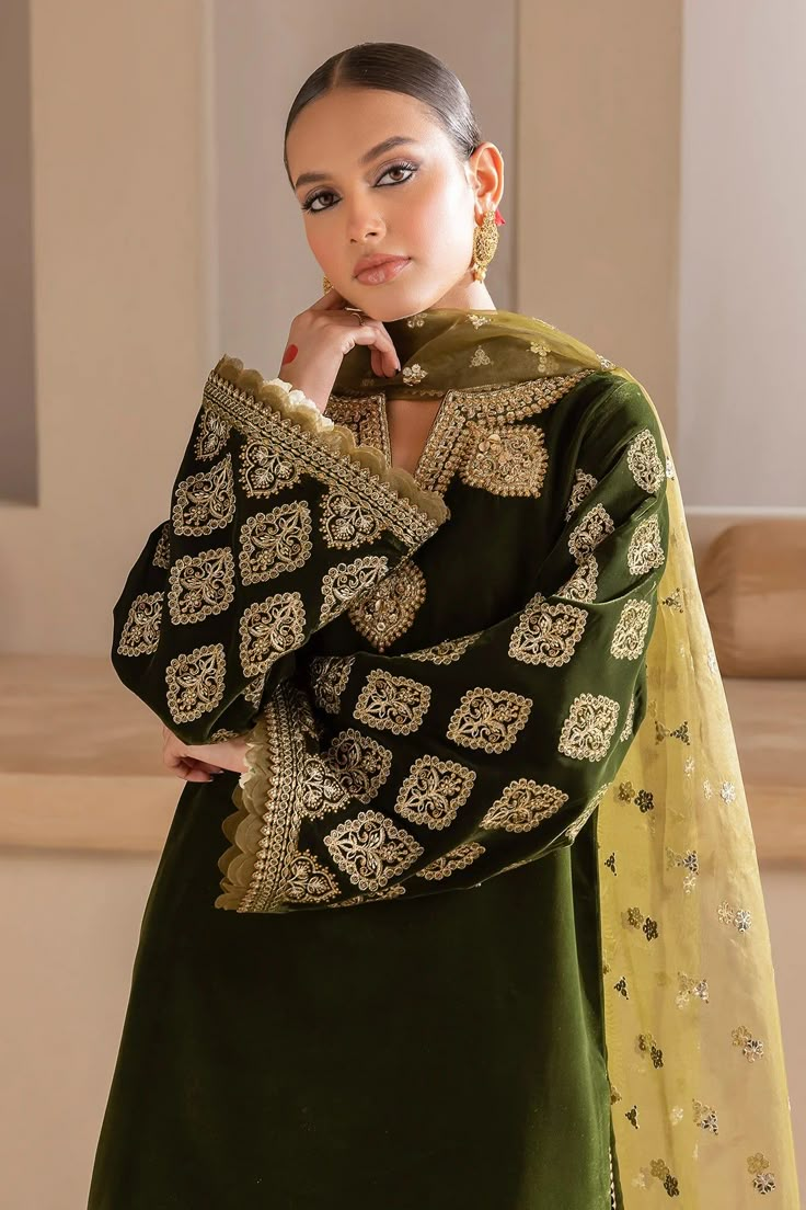 Orignal Designer Dark Olive Green Velvet Suit comes with embroidered handwork shirt, organza velvet border dupatta and embroidered pleated patiala salwar. Orignal Designer Suit - 3 Piece Hand embroidered Velvet Top Length: 36"-38" Bottom Length: 39"-42" Sleeves: 21" Side slit Pull-on style elastic waist patiala salwar with flat front waist band Wash Care: Dry Clean Inside Margin: 1" inchTouch and Feel: Soft and Comfortable Velvet Salwar Suit, Velvet Salwar, Shalwar Kameez Designs, Velvet Suit Design, Organza Suits, Velvet Dress Designs, Velvet Sleeve, Office Wear Women, Kurta Dress