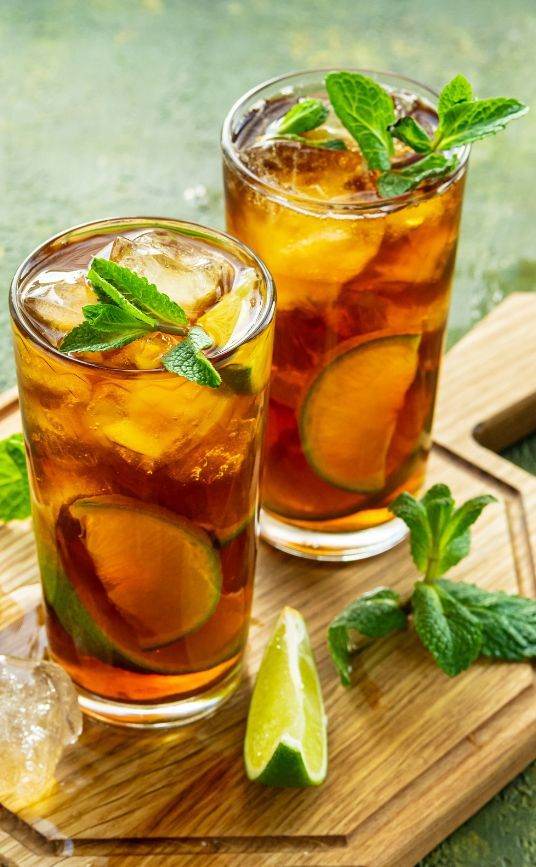 two glasses of iced tea with mint and lime